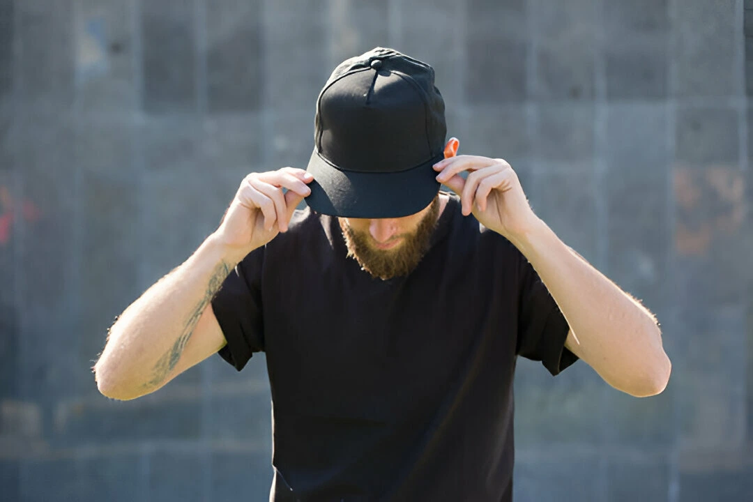 male model with beard wearing black blank baseball cap